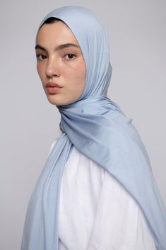 Our new improved jersey is super soft and so lightweight, that you won't even feel that you are wearing a hijab. So soft on your skin, it almost blends with it. This high quality, soft and stretchy hijab, is all that you need for effortless comfortability and joyful confidence. With a subtle sheen and a silky drape, it complements your skin, your outfit and you! 95 % Modal - 5 % Elastane Wash on 30 °C Dry flat No ironing needed Size: 75 x 185 centimeters *(Please be aware that sizes may vary sli Blue Hijab, Hijab Look, Jersey Hijab, Blue Jersey, Ice Blue, Your Skin, Confidence, Skin, High Quality