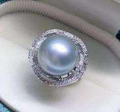 Stunning Tahitian Pearl Ring, 12.7mm, Beautiful Intense light Silvery Grey Color, High Luster.   Sterling Silver S925 with sparkling cubic zircons, Very Well made and Comfortable to wear. Open End Ring, fits US Size 6-8.  Classic and Elegant   Lustrous Beauty  Pearl ★ Pearl: Genuine Tahitian pearl, Saltwater  ★ Size: 12.7mm ★ Shape: Round ★ Color: Natural untreated, Intense light Silvery Grey Color, Beautiful ★ Luster: High Luster, Wonderful  ★ Surface: Nice, Baby Smooth and Mirror Like, Mostly Classic Pearl Jewelry, Clean Rings, Tahitian Pearl Ring, Nice Baby, Tahitian Pearls, Tahiti, Grey Color, Pearl Ring, Metal Rings