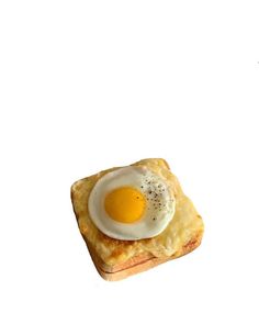 an egg is on top of some bread