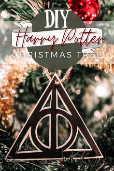 a harry potter christmas ornament hanging from a tree with the words diy harry potter