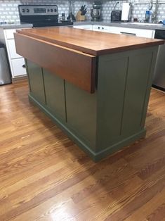 an island in the middle of a kitchen