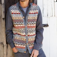 Our traditional hand knitted fairisle patterns in waistcoat form. Perfect over a shirt. Pachamama Mens hand knitted wool button up gilet vest. Traditional fair isle design for a classic look. Fair trade and handmade in Nepal. 100% Wool Unlined Hand knitted Coconut buttons Pockets at sides However, because our garments are handmade, we can experience slight variation in sizing. Have any exceptional size requests? Please place you order and message us in the 'Note to seller' Section. Washing Instructions: Dry Clean Only Pachamama has been designing and producing fairly traded woollens for 30 years. Check out more Pachamama Woolies here! - https://www.etsy.com/uk/shop/PachamamaWoollies?listing_id=792986773&ref=shop_overview_header&section_id=28478253 Fairisle Patterns, Luxury Men's Jacquard Knit Outerwear, Handmade Fair, G Man, Wool Wash, Fair Isle Pattern, Shell Buttons, Coconut Shell, Vest Outfits