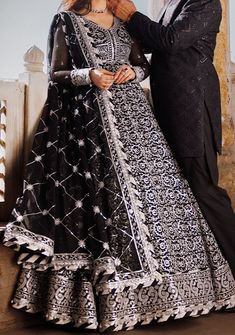 Introducing our New collection 'CHIKANKARI EID '24' by Asim Jofa designed to make you look and feel your best. Elevate your elegance with our mesmerizing black peshwas from Asim Jofa's "Chikankari" Eid collection. Adorned with intricate white Aari thread embroidery and shimmering silver sequins, this design creates a rhythmic pattern that casts a luminous effect capturing attention effortlessly. The embroidery showcases meticulous craftsmanship and timeless beauty making this ensemble a standout Black Georgette Bollywood Sharara, Black Bollywood Style Georgette Sharara, Wedding Lehenga With Dabka Work In Black, Black Wedding Lehenga With Dabka Work, Black Traditional Wear For Wedding And Diwali, Traditional Black Wear For Wedding And Diwali, Black Georgette Anarkali Set For Eid, Eid Black Georgette Anarkali Set, Black Salwar Kameez With Zari Work For Wedding