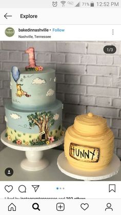 two cakes with winnie the pooh on them are sitting on top of each other