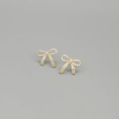 Rhinestone Pave petite bow tie earrings. 18k Gold and White Gold plated. Hypoallergenic. Measures at approximately 1 inch diameter. Cute Earrings For School, Bow Tie Earrings, Pretty Gold Earrings, Bow Earrings Gold, Gold Bow Earrings, Fancy Gold Earrings, Preppy Jewelry, Jewelry Accessories Ideas, Bow Jewelry