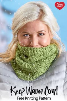 a woman wearing a green knitted cowl with the words keep warm over her face