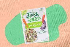 a package of fresh success coleslaw on a pink and green background