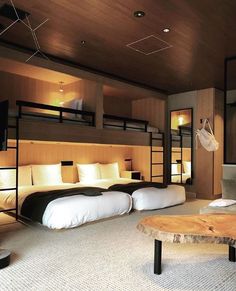 a bedroom with bunk beds and white pillows