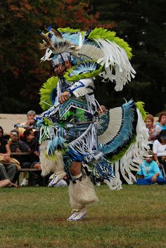 a native american dancer performing in front of an audience