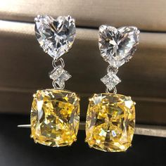 SKU#: OB148ER Earrings InformationMetal: 925 Sterling SilverPlating Color: SilverPrimary InformationStone Type: Lab-Created GemstoneStone Color: Fancy Yellow & WhiteStone Shape: Cushion Cut & Heart CutStone Size: 10*12mm (Cushion Cut) 8*8mm (Heart Cut)Stone Setting: Prong *All stone weights (CT.) are approximate and listed as diamond equivalent weight in carats. Also total weight of the Earrings, Earrings width & thickness may have a slight deviation no more than 5%.*Photos may be enlarged to sh Big Diamond Earrings, Yellow Diamond Earrings, Neon Nike, Diamond Earrings Wedding, Yellow Diamond Earring, Crystal Crown Wedding, Canary Diamond, Crystal Earrings Wedding, Earrings Luxury