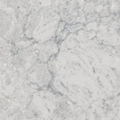 a white marble textured surface with grey veiners