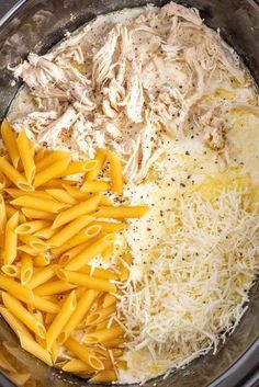 pasta, chicken and parmesan cheese are in the crock pot