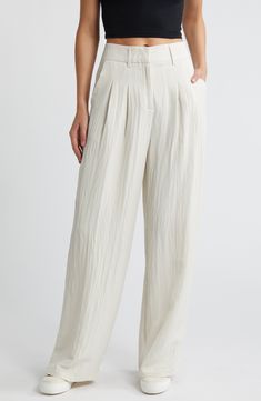 Soft pleats lend graceful movement to these high-waist pants designed with a crinkled texture and flowy wide legs. Zip fly with hook-and-bar closure 55% polyester, 37% viscose, 8% nylon Machine wash, dry flat Imported Spring Wide-leg Crinkle Texture Pants, Spring Wide-leg Pants With Crinkle Texture, Off White Wide Leg Relaxed Fit Pants, Off White Relaxed Fit Wide Leg Pants, Off White Linen Wide Leg Bottoms, White Pleated Wide Leg Pants, Summer Wide Leg Bottoms With Crinkle Texture, Summer Wide Leg Crinkle Texture Pants, Summer Wide Leg Pants With Crinkle Texture