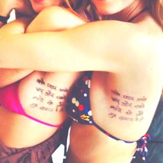 two girls with tattoos on their arms hugging each other and saying love in different languages