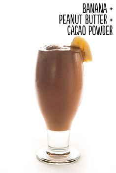 a chocolate drink in a glass with an orange slice on top and the words banana peanut butter caco powder