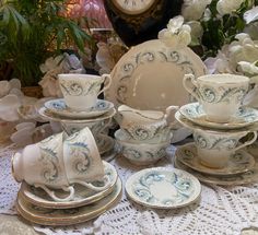 a table topped with white and blue china