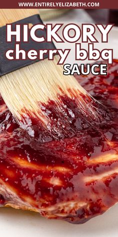 a close up of a brush with sauce on it's side and the words hickory cherry bbq sauce