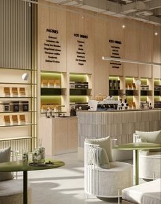 the interior of a coffee shop with tables and chairs