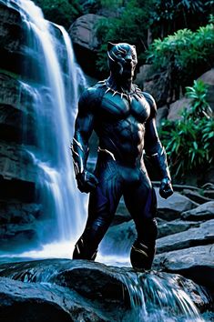 a man standing in front of a waterfall wearing a helmet and body suit with his hands on his hips