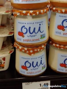 jars of french style yogurt with pumpkins on display in a grocery store