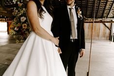 a bride and groom posing for a photo