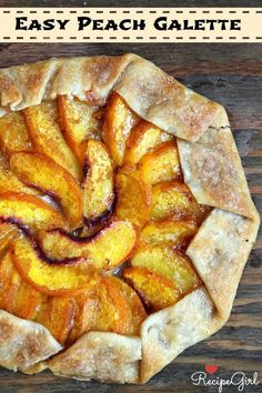 an apple pie is shown on a wooden table