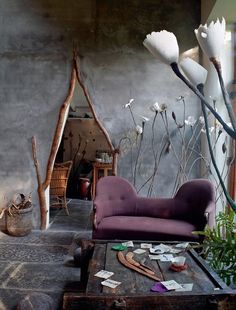 a living room filled with furniture and flowers