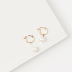 "Penelope" Baroque Pearl Hoop Earrings Stephanos' latest addition "Penelope" Baroque Pearl Hoop Earrings are the must have jewelry for this season. 14K Gold filled lavish hoops elegantly hold silver dewdrops of an early sunrise. Wear the warm glow of Penelope and pair it with style dress up or cozy up. Penelope Baroque Pearl Hoop’s iconic style radiates glamour and spreads warmth in an intimate setting. Available with white pearls and black pearls to match your outfit and look you finest. Each p Elegant Small Hoop Pearl Earrings In 14k Gold Filled, Elegant 14k Gold Filled Hoop Earrings, Elegant Small Hoop Huggie Earrings In 14k Gold Filled, Elegant Small Hoop Earrings In 14k Gold Filled, Elegant Small Hoop 14k Gold Filled Pearl Earrings, Elegant Small Hoop Huggie Earrings With Pearl Charm, Gift Baroque Pearl Hoop Earrings, Elegant Pearl White Baroque Earrings, Single White Baroque Pearl Hoop Earring