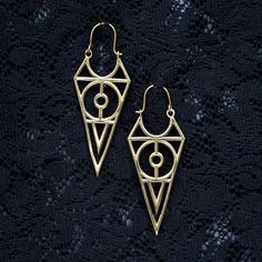 Geometric sacred geometry pointed triangle hoop earrings. Length from top to bottom: 65mm (2 3/4 inch).Made of nickel free brass.Check out our selection of earrings here:https://www.etsy.com/shop/ekekocrafts/items?ref=hdr_shop_menu&section_id=19502592These are available for wholesale too. Please don't hesitate to contact us for more information or if you have any questions.Please like our facebook page for news and special offers:https://www.facebook.com/ekekocrafts/Thank you for visiting ek Bohemian Triangle-shaped Jewelry For Festivals, Bohemian Gold Triangle Jewelry, Bohemian Geometric Gold Jewelry, Faerie Clothes, Eye Mandala, Crop Circle, Bohemian Jewellery, Crop Circles, Triangle Earrings