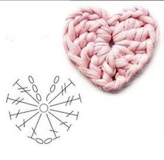 a crochet heart next to a knitting needle