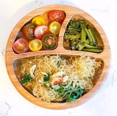 a wooden plate topped with different types of food