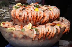 a large bowl filled with lots of cooked shrimp