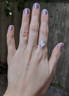 -------------------------------------------------------- THE PRODUCT This listing is for our gorgeous opal Texas shape ring. We completely hand make these ourselves from a white fire opal that is predominately white but has gorgeous flashes of reds and blues. Pictured here I have the ring shown in several different light levels to see how the colors of the stone changes in brighter and darker light. Each piece is completely unique and will have it's own color variations, but all are very bright White Opal Dainty Birthstone Ring, White Dainty Opal Birthstone Ring, White Opal Birthstone Promise Ring, White Opal Crystal Ring For Gift, White Opal Ring As A Gift, White Opal Ring For A Gift, White Opal Crystal Promise Ring, Minimalist White Opal Open Ring, Adjustable White Opal Open Ring