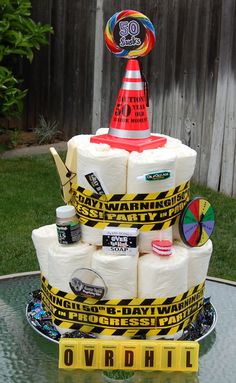 a cake made to look like a construction site with lots of toilet paper on top