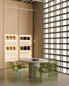 an empty room with chairs and tables in front of a book shelf filled with books