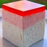 a red, white and grey block sitting on top of a table