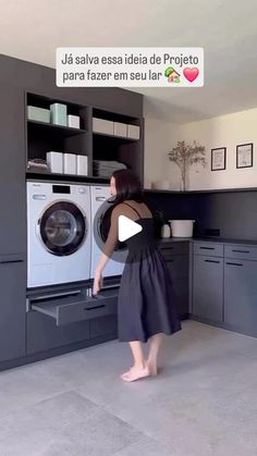 a woman is standing in front of a washing machine