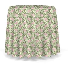 a pink and green table cloth with leaves on it