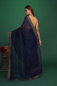 Slay with your elegance at parties and festive occasions in this stunning navy blue organza sari with embroidered border. It comes with a heavy embroidery saree blouse. Shop designer sarees online in USA from Pure Elegance. Disclaimer: The shown stitched blouse on the model is for display purpose only. The saree comes with a matching blouse and finished with fall and piko. Blue Organza Pre-draped Saree With Dupatta, Blue Organza Pre-draped Saree With Pallu, Designer Blue Sharara With Embroidered Border, Designer Pre-draped Organza Saree With Embroidered Border, Designer Organza Pre-draped Saree With Embroidered Border, Blue Organza Pre-draped Saree For Diwali, Blue Sharara With Embroidered Border, Traditional Blue Organza Blouse Piece, Traditional Blue Organza Blouse