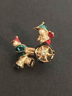 Vintage Rickshaw Pin. Mid Century Brooch. Asian Theme, 1950s , Gold tone , Red Green Enamel, Faux Pearls , Rhinestones. The brooch measures 1 x 1" and has a safety clasp. Condition is good with some loss of the painted on enamel. Very sweet 1940's - 1950's brooch. Mood Ring Colors, Color Changing Ring, Hippie Necklace, Green Enamel, Cool Necklaces, Rhinestone Jewelry, Vintage Brooches, Red Green, Faux Pearl