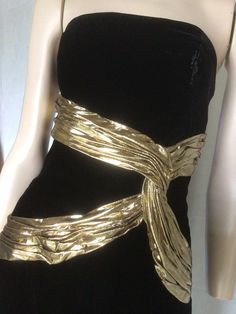 "Vtg 80s A J Bari black and gold Velvet sleeveless Cocktail Dress 8 Preowned. Condition 10/10. No issues to note.  Style A straight form fitting knee length dress,  the bodice is boned for structure and support. Gold lame ribbon swaiths across the bodice give further definition and a unique aspect to this dress. Suitable for any formal, social event, this dress would be a valuable go to in any fashion fashionista wardrobe. Easy to style Fully lined Fastens with a centred rear zip. 7.5\" Front centre kick pleat.  Clipped to the mannequin. Size to fit Australian 10 Go by measurements below garment laid flat Underarm to underarm. 17\". 43cm Waist. 14\". 35.5cm Hips. 18.5\". 47cm Length from underarm. 32\". 81cm Be unique, wear vintage. My photos form an important part of the product descripti Vintage Gold Dress For Party Season, Gold Dress Aesthetic, 80’s Dresses, Gold Glitter Dress, Clawdeen Wolf, Velvet Party Dress, Gold And Black Dress, Golden Dress, Velvet Cocktail Dress