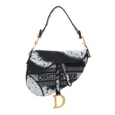 This is an authentic CHRISTIAN DIOR Canvas Embroidered Tie Dye Saddle Bag in Blue and Multicolor. This saddlebag is made of Dior monogram canvas.  It features a matching looping handle, a rear fat pocket, brass hardware, and a crossover flap opens to an unlined fabric interior. Designer Shoulder Bag With Embroidered Logo, Designer Saddle Bag With Removable Pouch, Black Top Handle Shoulder Bag With Embroidered Logo, Black Shoulder Bag With Top Handle And Embroidered Logo, Designer Canvas Bags With Embroidered Logo, Evening Bags With Embroidered Logo, Luxury Blue Bag With Embroidered Logo, Luxury Blue Bags With Embroidered Logo, Designer Canvas Shoulder Bag With Embroidered Logo