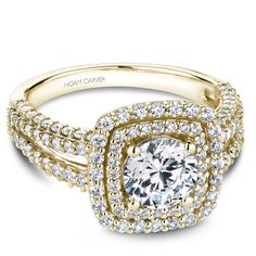 a yellow gold engagement ring with two rows of diamonds on the band and a center stone surrounded