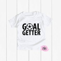 Goal Getter Soccer Shirt, Trendy Toddler Shirt, Trendy Kids Clothes, Toddler Soccer Shirt, Kids Graphic Tee, Kids Soccer Shirt, Soccer Shirt The design is adhered to the shirt with a premium professional heat press for optimum quality! I use TOP Quality Shirts. The shirts are VERY SOFT!! The shirts are true to size. Shirts ship out within 1 business days (MON-FRI) or less and take an additional 2-5 days to arrive. Each shirt is custom and made special just for your little one.  Subscribe to Our Toddler Soccer, Trendy Kids Clothes, Random Kid, Kids Graphics, Goal Getter, Trendy Kids Outfits, Soccer Shirt, Kids Soccer, Trendy Kids