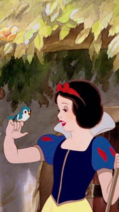 snow white holding a bird in her hand and looking at it's own face