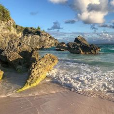 the beach is covered with rocks and water