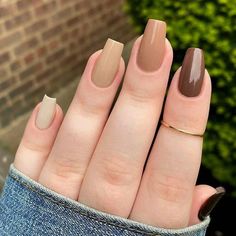 a woman's hand with two different manies and one has a ring on it