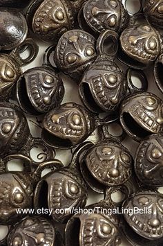 many metal buttons with faces on them