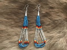 Authentic Beautiful Native American Indian Jewelry Navajo Hand Beaded Long Dangle Earrings. Great for a gift❤️ Handcrafted by Navajo Artist H. Crosby These beautiful earrings are 4.5" in length and 1" in width. Southwestern Teardrop Beaded Earrings, Southwestern Style Blue Beaded Earrings, Southwestern Style Beaded Earrings For Festival, Silver Southwestern Beaded Earrings, Adjustable Southwestern Beaded Earrings, Indian Jewelry Earrings, American Indian Jewelry, Southwestern Jewelry, Long Dangle Earrings