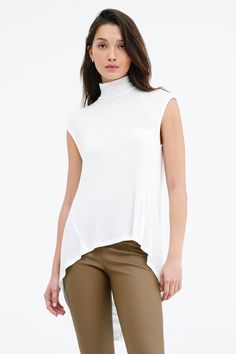 Our Vivienne Top will bring casual glamour to your wardrobe. Remixing the silhouette of our best-selling Halle Tunic for warmer temps, she begins with a turtleneck, drapes into an open cowl back and finishes with a dynamic high-low hem. Sleeveless and fashioned from silky soft, sheer European jersey, Vivienne's designed to move in free-flowing rhythm with you no matter the setting.[SPLIT] Yada, in off white, is 5'9" (175 cm) tall, wearing size XS. Astrid, in pink, is 5'9" (175 cm) tall, wearing Chic High Neck Mock Top For Layering, Chic Spring Turtleneck, Versatile Mock Neck Top For Layering, Versatile Funnel Neck Turtleneck For Spring, Chic Mock Neck Top For Layering, Chic Mock Neck Turtleneck Top For Layering, Flowing Rhythm, Casual Glamour, Tunic Hoodie